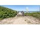 Wooden walkway over the dunes leading to the beach at 3170 Ocean Shore Blvd # 5010, Ormond Beach, FL 32176