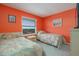 Twin bedroom with window view, cozy beds, and an inviting decor at 3170 Ocean Shore Blvd # 5010, Ormond Beach, FL 32176