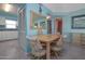 Dining area adjacent to the kitchen with a table for four at 3170 Ocean Shore Blvd # 5010, Ormond Beach, FL 32176