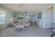 Living room with views into the kitchen and other living spaces with neutral decor at 3170 Ocean Shore Blvd # 5010, Ormond Beach, FL 32176