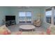 Cozy living room with beach view from the sliding glass doors, perfect for relaxing at 3170 Ocean Shore Blvd # 5010, Ormond Beach, FL 32176