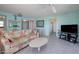 Open-concept living room featuring views into other areas of the home at 3170 Ocean Shore Blvd # 5010, Ormond Beach, FL 32176
