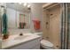 Clean bathroom featuring a shower, a toilet and single sink, complimented by colored towels at 325 Wilder Blvd # A102, Daytona Beach, FL 32114