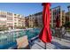 Enjoy the outdoors relaxing around the pool with an umbrella, chairs, and tables at 325 Wilder Blvd # A102, Daytona Beach, FL 32114