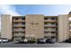 Exterior view of Wilder Blvd Condominiums featuring a multi-story building with balconies and ample parking at 325 Wilder Blvd # A102, Daytona Beach, FL 32114