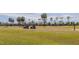 Scenic view of a lush golf course with golfers enjoying a sunny day at 325 Wilder Blvd # A102, Daytona Beach, FL 32114