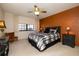 Spacious bedroom featuring a large window, and neutral carpet, complimented by a statement wall at 325 Wilder Blvd # A102, Daytona Beach, FL 32114