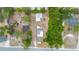 Aerial image of property highlighting nearby road, and dense foliage on property line at 32811 County Road 473, Leesburg, FL 34788
