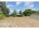 Wide backyard showing open shed space and a separate smaller storage building at 32811 County Road 473, Leesburg, FL 34788