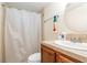 Bathroom with a shower with a curtain, toilet, and a single sink at 32811 County Road 473, Leesburg, FL 34788