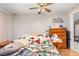 Bedroom with a ceiling fan, providing a comfortable and personal space at 32811 County Road 473, Leesburg, FL 34788