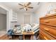 Bedroom featuring a ceiling fan and built-in shelving, providing comfortable space at 32811 County Road 473, Leesburg, FL 34788