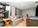 Cozy living room featuring a comfortable leather sofa, a desk, and a bookcase at 32811 County Road 473, Leesburg, FL 34788