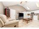 Spacious living room with tile flooring, vaulted ceilings, and abundant natural light at 32811 County Road 473, Leesburg, FL 34788