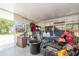 Outdoor covered patio featuring a seating area and plenty of storage space at 32811 County Road 473, Leesburg, FL 34788
