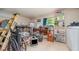 Storage room with a ladder, white shelves and a washer at 32811 County Road 473, Leesburg, FL 34788