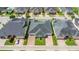 Aerial view of homesites featuring well manicured lawns, paver driveways and mature landscaping at 3402 Torre Blvd, New Smyrna Beach, FL 32168