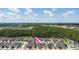 Aerial view of a suburban home featuring manicured landscaping and a brick driveway at 3402 Torre Blvd, New Smyrna Beach, FL 32168
