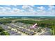 Aerial shot featuring a suburban home nestled in a well-maintained neighborhood and pond views at 3402 Torre Blvd, New Smyrna Beach, FL 32168