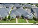 Aerial view of homesites featuring well manicured lawns, paver driveways and mature landscaping at 3402 Torre Blvd, New Smyrna Beach, FL 32168