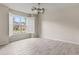 This bedroom features a modern ceiling fan, an exterior window with shutters, and beautiful wood-look flooring at 3402 Torre Blvd, New Smyrna Beach, FL 32168