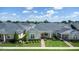 Charming single-story home featuring manicured landscaping and a welcoming brick pathway to the front door at 3402 Torre Blvd, New Smyrna Beach, FL 32168