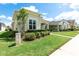 Well-maintained single-story home featuring manicured shrubs and a neatly kept lawn on a sunny day at 3402 Torre Blvd, New Smyrna Beach, FL 32168