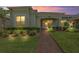 Charming single-story home featuring a brick walkway, manicured shrubs and a well maintained lawn at 3402 Torre Blvd, New Smyrna Beach, FL 32168