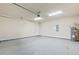 Spacious garage with high ceilings, overhead lighting, and ample room for vehicles and storage at 3402 Torre Blvd, New Smyrna Beach, FL 32168