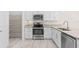 Bright, updated kitchen with stainless steel appliances, granite countertops, and ample cabinetry at 3402 Torre Blvd, New Smyrna Beach, FL 32168