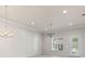 Well-lit living area featuring wood floors, recessed lighting, and a door to the outside at 3402 Torre Blvd, New Smyrna Beach, FL 32168