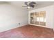 Enclosed patio featuring brick floors and view of the kitchen through the glass sliding doors at 3402 Torre Blvd, New Smyrna Beach, FL 32168