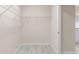 An empty walk-in closet with wire shelving and wood-look flooring at 3402 Torre Blvd, New Smyrna Beach, FL 32168