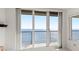 Bright white sliding doors leading to a balcony with an ocean view at 3425 S Atlantic Ave # 1602, Daytona Beach, FL 32118