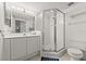 Neutral bathroom featuring a walk-in shower, toilet and single sink with ample lighting at 3425 S Atlantic Ave # 1602, Daytona Beach, FL 32118