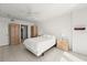 Bright bedroom featuring white walls, tile floors, ceiling fan and neutral decor at 3425 S Atlantic Ave # 1602, Daytona Beach, FL 32118