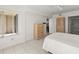 Bright bedroom featuring tile flooring, a window with a view, and closet space at 3425 S Atlantic Ave # 1602, Daytona Beach, FL 32118