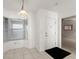 Bright entryway with a large window, white door, and tiled floor at 3425 S Atlantic Ave # 1602, Daytona Beach, FL 32118