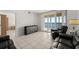 Spacious living room with ocean view, black sofas, and modern cabinet at 3425 S Atlantic Ave # 1602, Daytona Beach, FL 32118