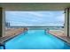 A rectangular swimming pool with a clear view to the ocean and sky at 3425 S Atlantic Ave # 1602, Daytona Beach, FL 32118