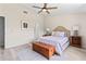 Comfortable bedroom with a ceiling fan, neutral tones, and wood-look flooring at 35 China Moon Dr, Ormond Beach, FL 32174