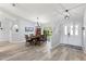 Dining room with an arched window and views to the front yard. Seats six at 35 China Moon Dr, Ormond Beach, FL 32174