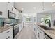 Modern kitchen with stainless steel appliances, granite countertops, and ample cabinet space at 35 China Moon Dr, Ormond Beach, FL 32174