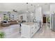 Spacious open concept kitchen with a long center island featuring barstool seating, and stainless steel appliances at 35 China Moon Dr, Ormond Beach, FL 32174