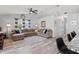 Spacious living room features a large sectional sofa, neutral decor, and ample natural light at 35 China Moon Dr, Ormond Beach, FL 32174