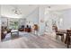Open-concept living area featuring hardwood floors and ample natural light at 35 China Moon Dr, Ormond Beach, FL 32174