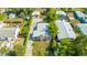 Aerial view of a single-Gathering home with mature trees and a detached garage at 355 Hartford Ave, Daytona Beach, FL 32118