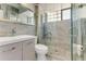Modern bathroom features a glass enclosed shower and updated vanity at 355 Hartford Ave, Daytona Beach, FL 32118