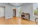 Bedroom with hardwood floors, desk, closet, and natural light from a window at 355 Hartford Ave, Daytona Beach, FL 32118