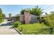 Charming single story home featuring stone accents, a brick chimney and mature landscaping at 355 Hartford Ave, Daytona Beach, FL 32118